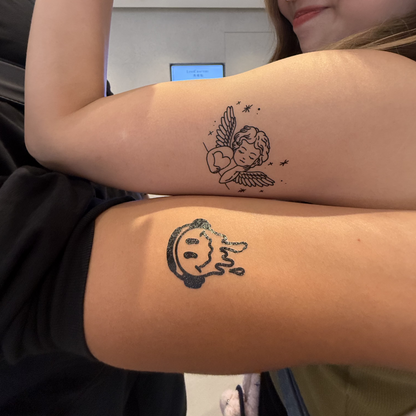 Temporary tattoo model - Cupid tattoo and Smile with Headphone tattoo